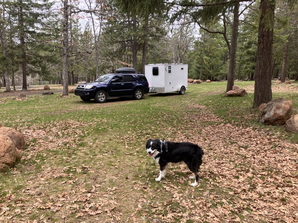 Flynn, our SUV, and our camper in Washington State. 